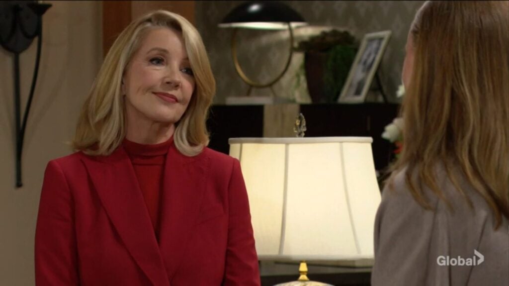 Nikki Newman smiles at Claire Grace.