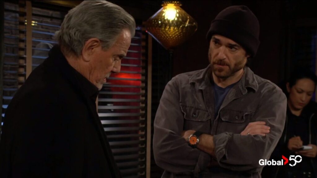 Victor Newman talks to the bartender.