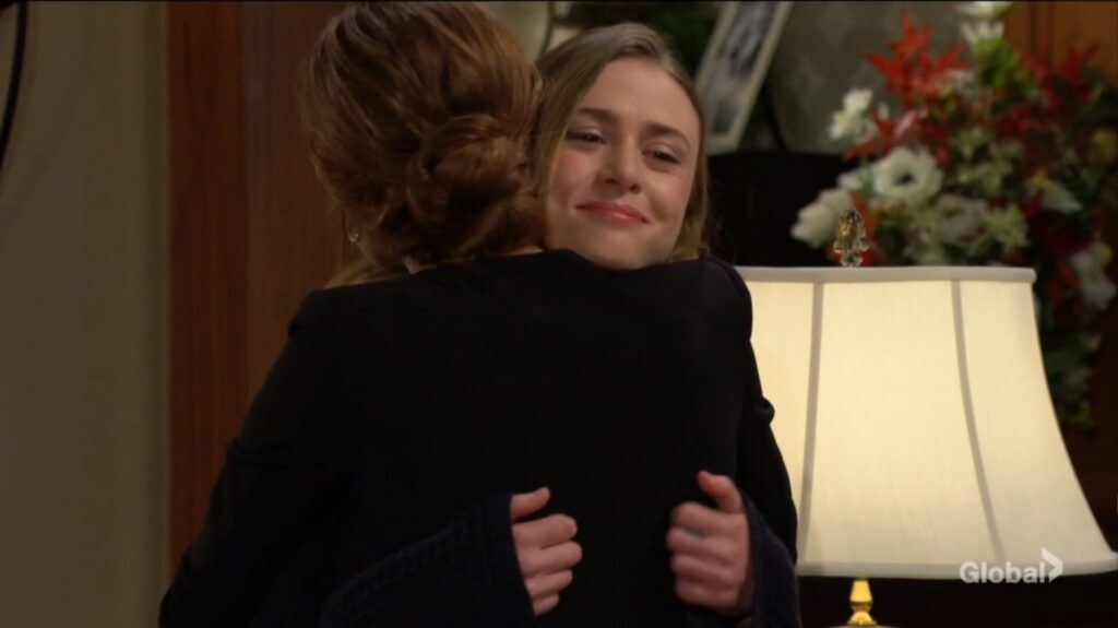 Claire and Victoria hug.