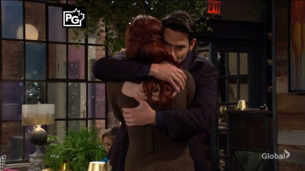 Adam Newman hugs Sally Spectra.