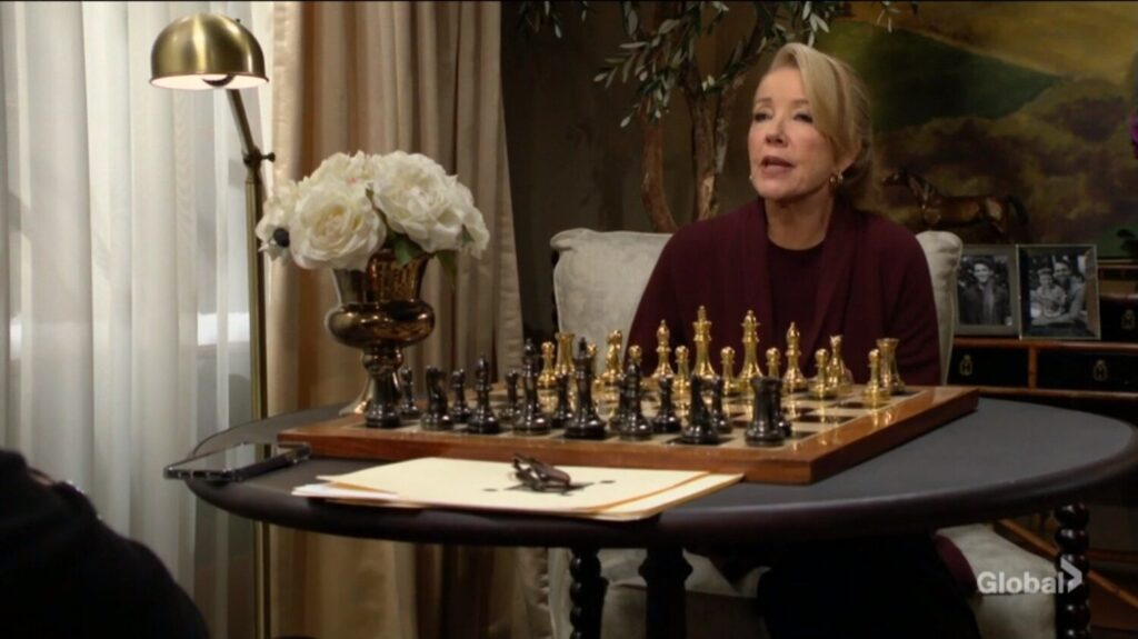 Nikki Newman talks to her husband over a chessboard.