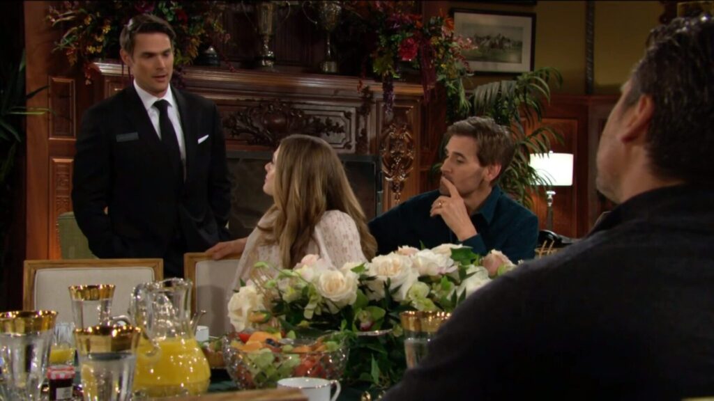 Adam talks to Claire as Cole and Nick look on.