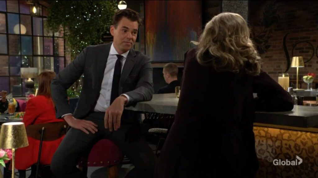 Billy Abbott sits at the bar and smiles at his sister, Ashley Abbott.