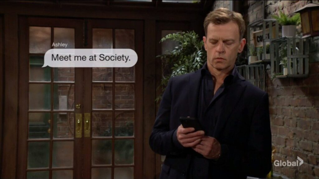 Tucker gets a text message from Ashley. "Meet me at Society."