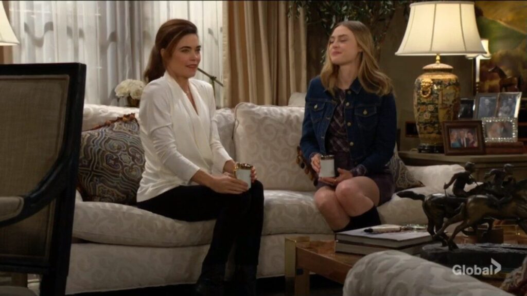 Victoria Newman and Claire Grace sit on the sofa and talk.