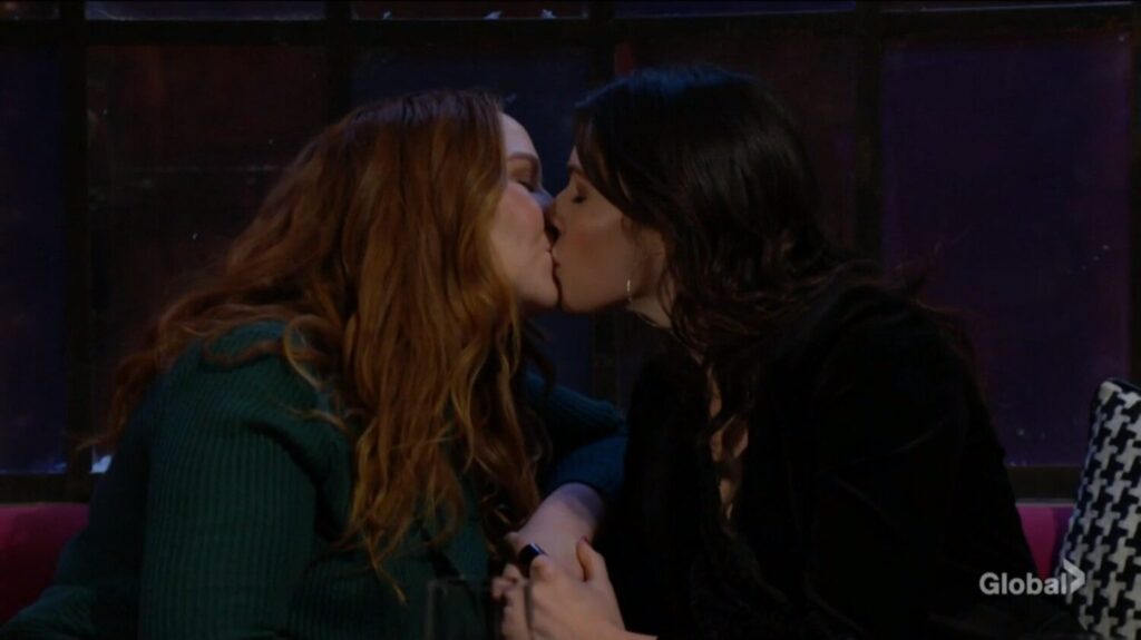 Mariah and Tessa kiss.