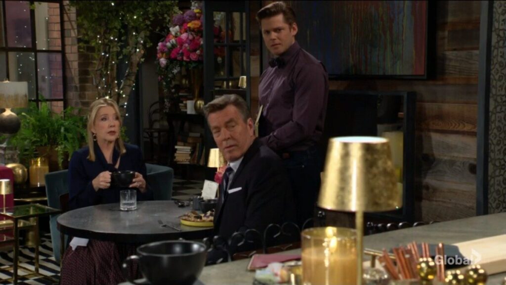 Nikki Newman, the bartender, and Jack Abbott look at the bar.