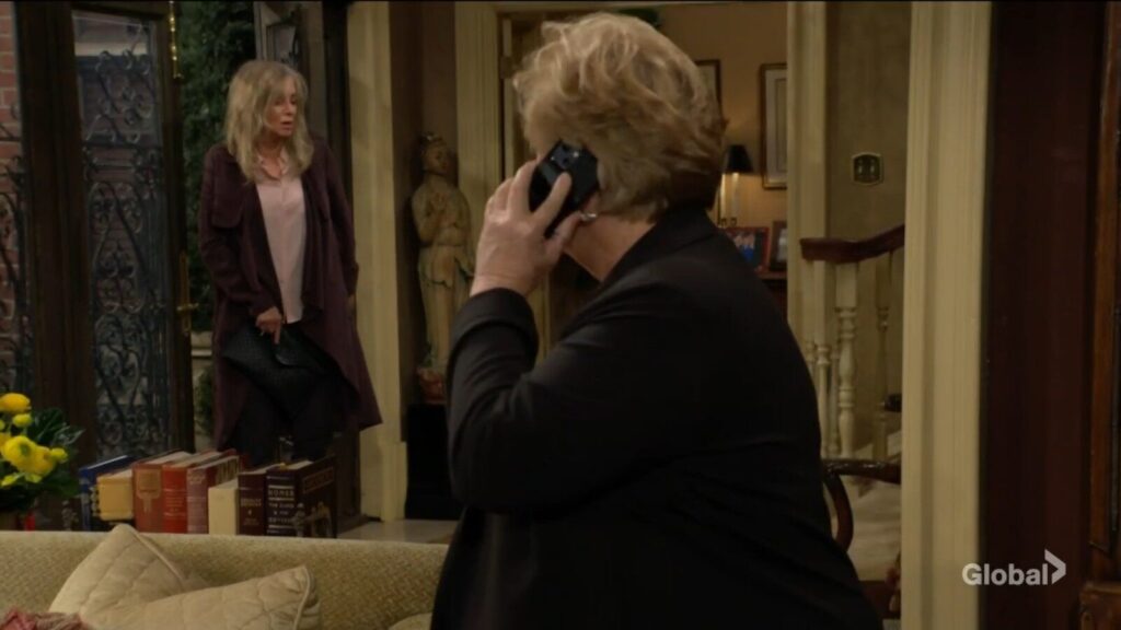 Ashley Abbott enters the foyer as Traci is on the phone.