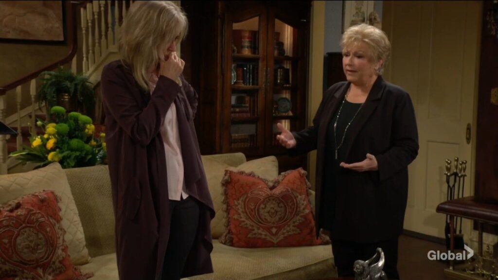 Traci gestures as she talks to Ashley.