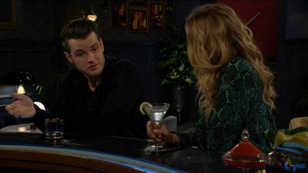Kyle talks with Summer as they sit at the bar.