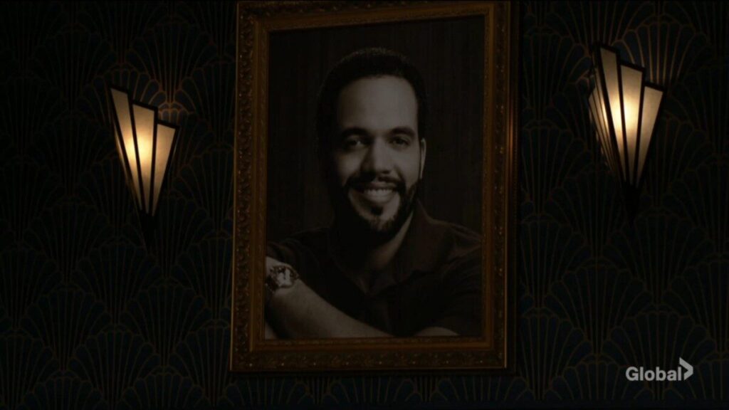 A portrait of Neil Winters on the lounge wall.