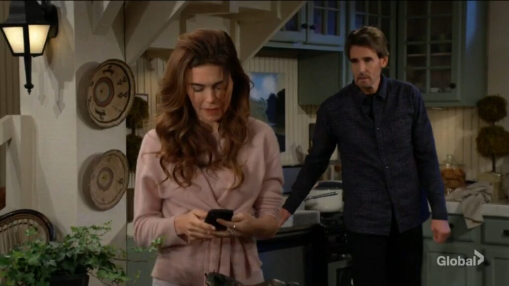 Victoria looks at her phone as Cole talks.