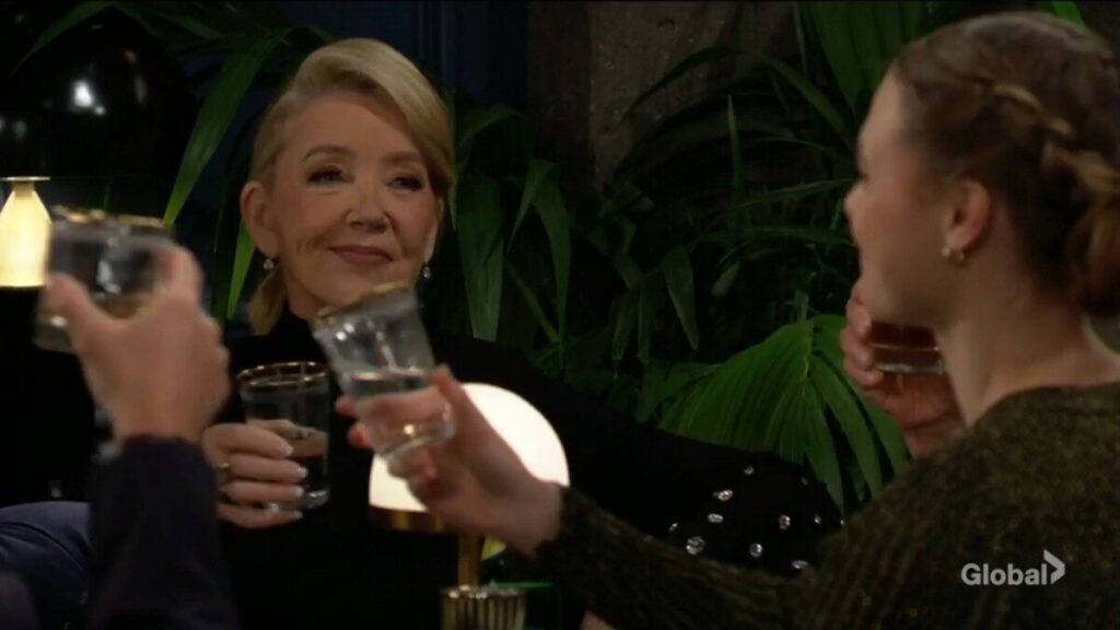 Nikki Newman toasts with Claire.