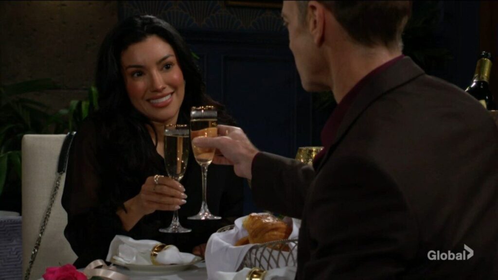 Audra beams as she and Tucker clink glasses in a toast.