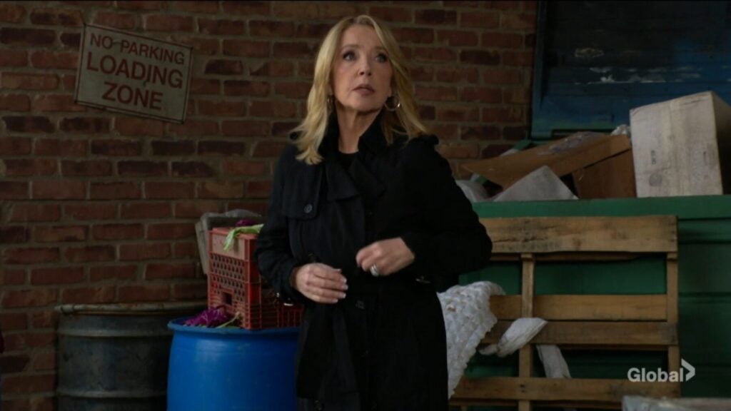 Nikki Newman in a back alley.